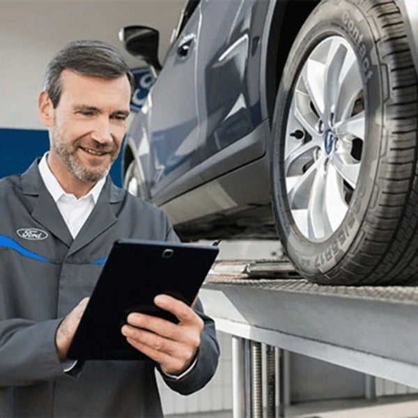 image of a man holding a tablet