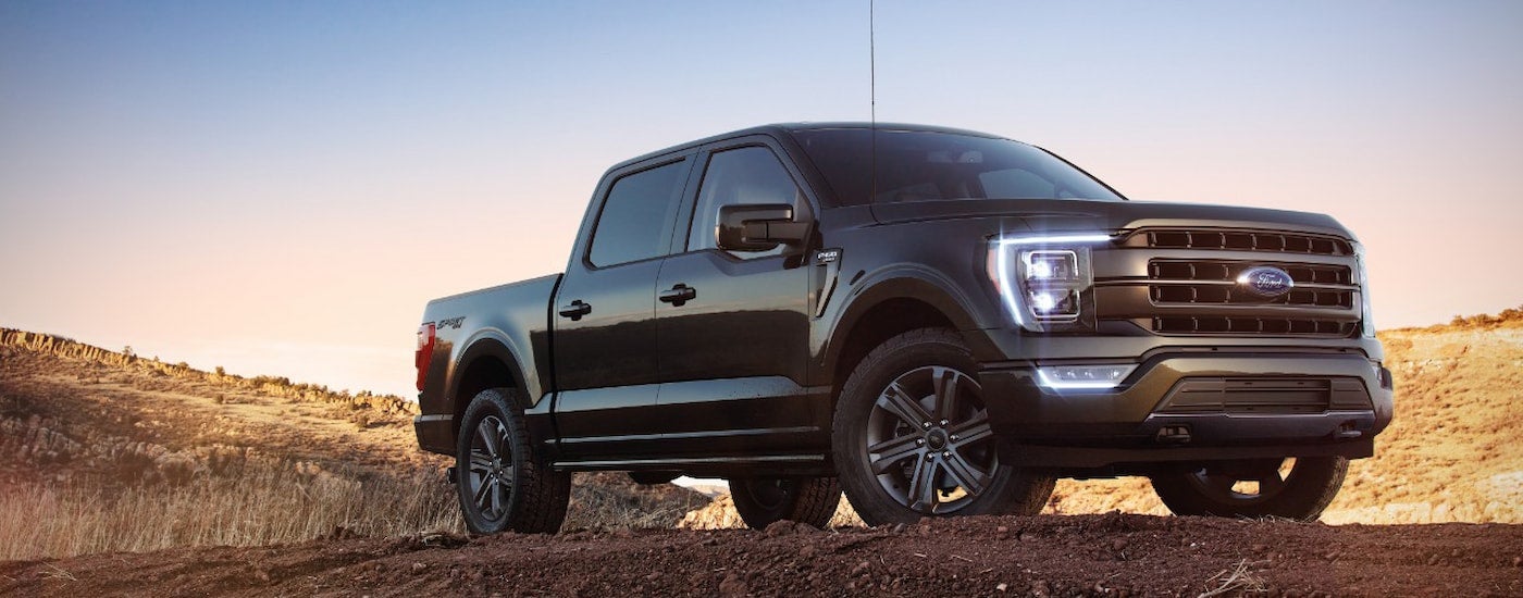 A black 2022 Ford F-150 XL Sport parked off-road