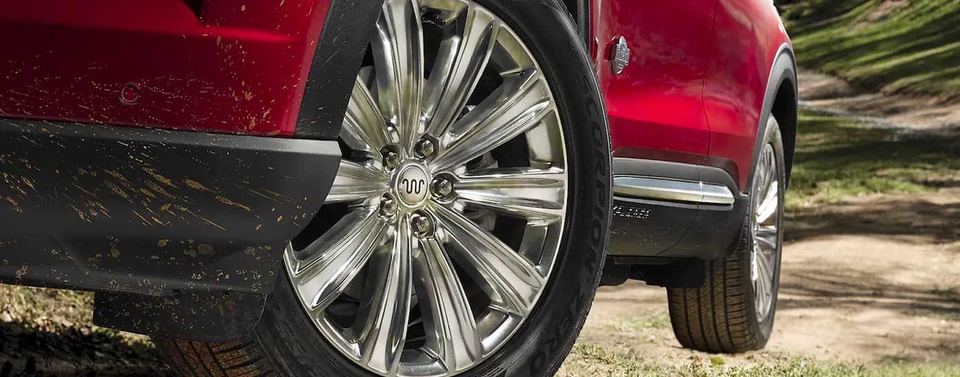 Close-up on the wheels of a red 2023 Ford Explorer King Ranch.