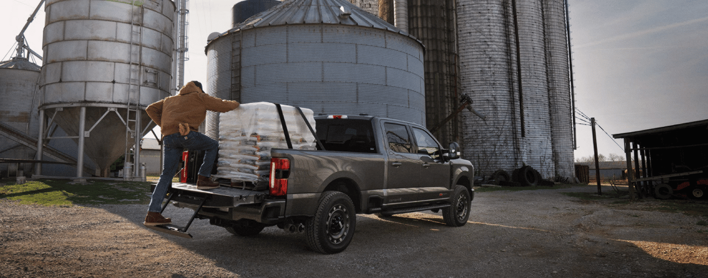 Grey 2026 Ford F-250 SD Carhart Edition parked on a farm