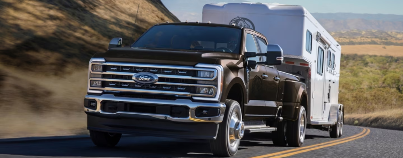 Brown 2026 Ford F-350 Super Duty for sale in Birch Run towing a camper