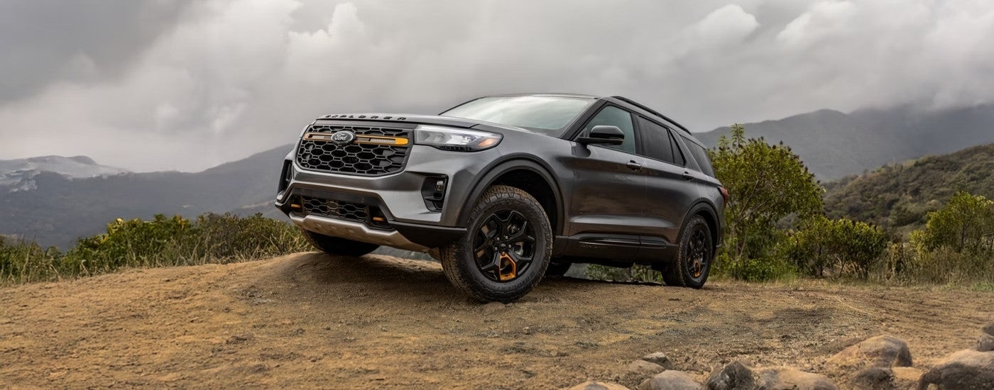 A gray 2025 Ford Explorer Tremor off-roading in dirt