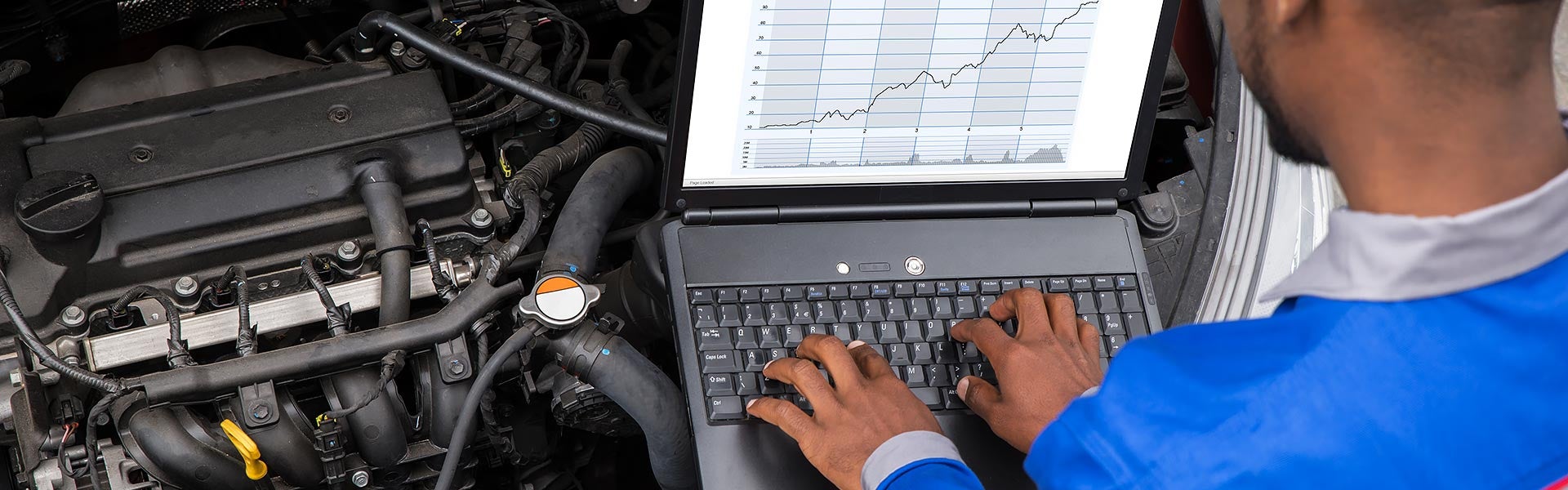 Service Technician Evaluating a Used Vehicle